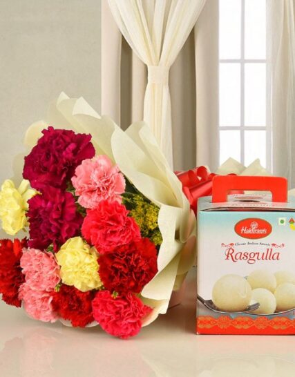 Giftnmore-12 Mixed Color Carnations in White Paper & 1 Kg Haldiram Rasgulla