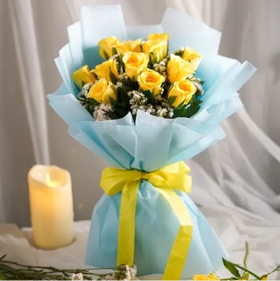 8 stunning yellow roses wrapped in elegant blue paper