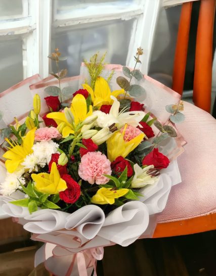 ADORABLE LILIES WITH RED ROSES N PINK CARNATION AND WHITE CARNATION WITH NICE WRAP