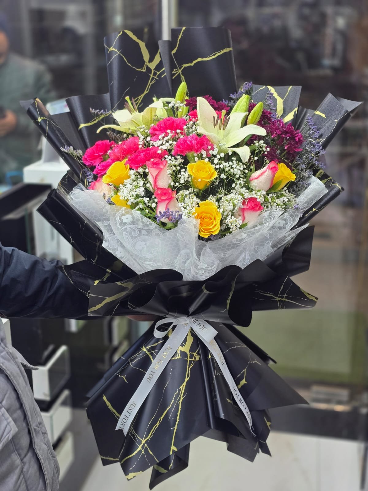 Luxury mixed flower bouquet with lilies and roses